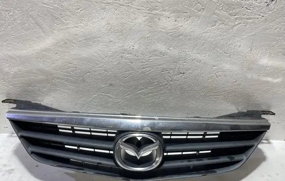 Mazda 626 Front bumper upper radiator grill GG2M50712