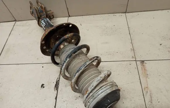 Opel Corsa D Front shock absorber with coil spring