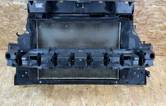 Radiator support slam panel