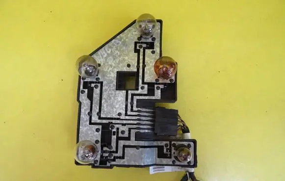 Tail light bulb cover holder