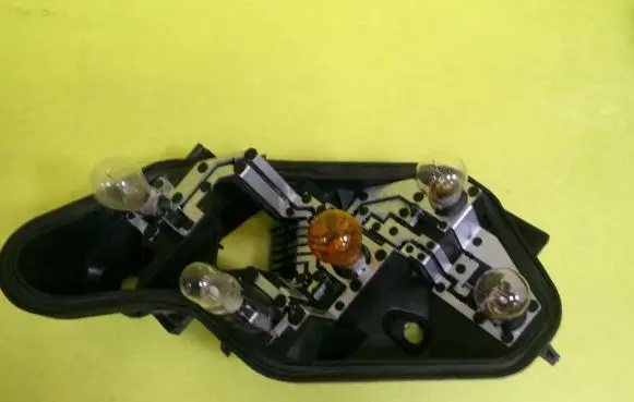 Opel Corsa D Tail light bulb cover holder