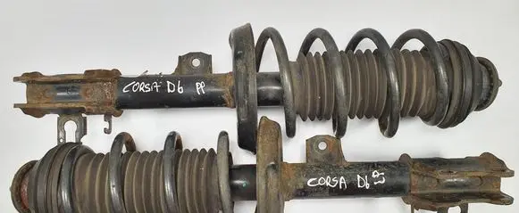 Opel Corsa D Front shock absorber with coil spring 13240917