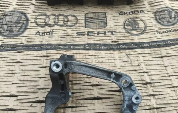 Audi A5 A/C compressor mount bracket 06m260885m