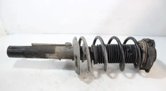 Volkswagen Golf V Front shock absorber with coil spring