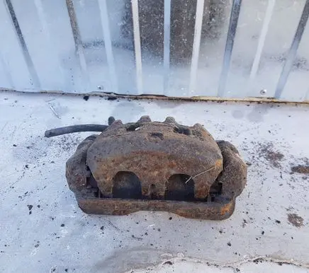 Subaru Forester SF Front brake caliper