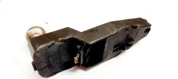 Tail light bulb cover holder