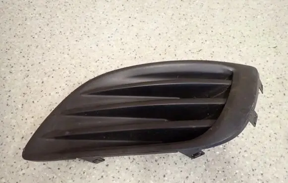 Suzuki Swift II Front fog light trim/grill