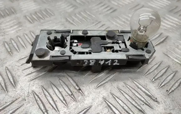 Tail light bulb cover holder