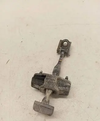 Front door check strap stopper