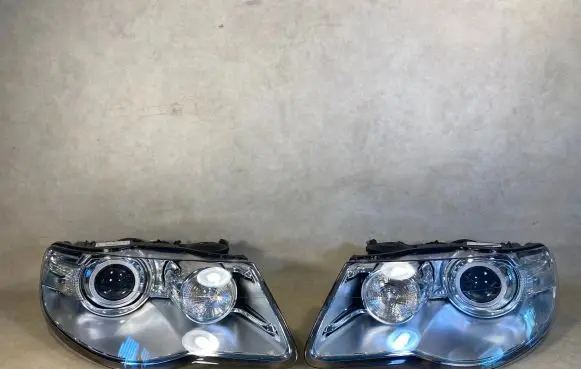 Volkswagen Touareg I Headlights/headlamps set 7L6941031C 7L6941032C