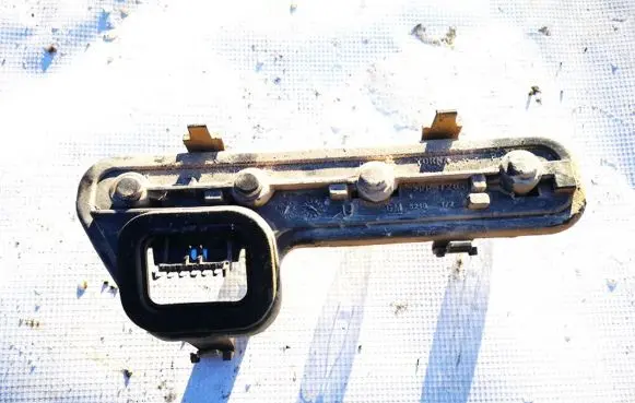 Tail light bulb cover holder