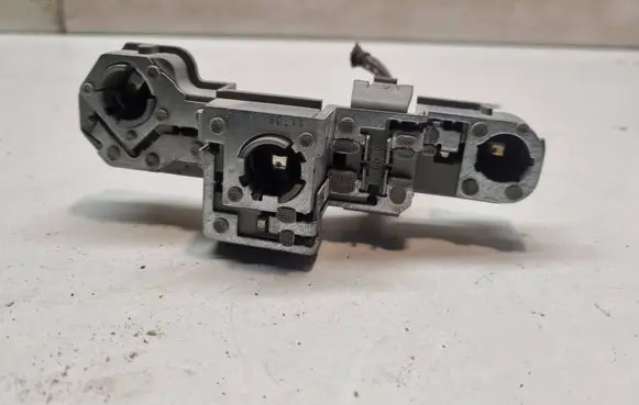 Tail light bulb cover holder