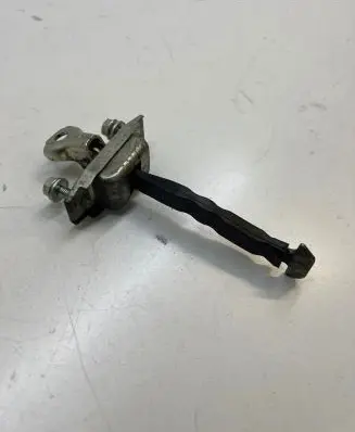 Front door check strap stopper