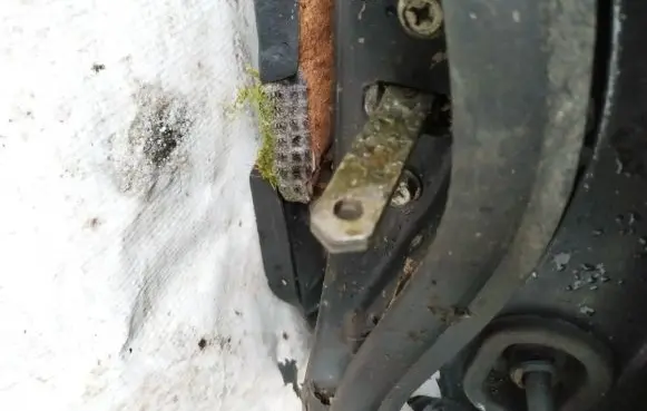 Front door check strap stopper