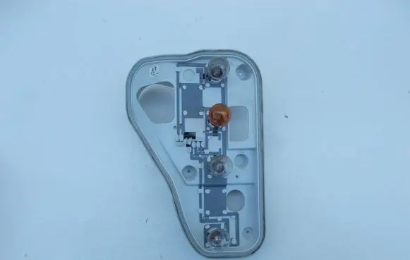 Tail light bulb cover holder