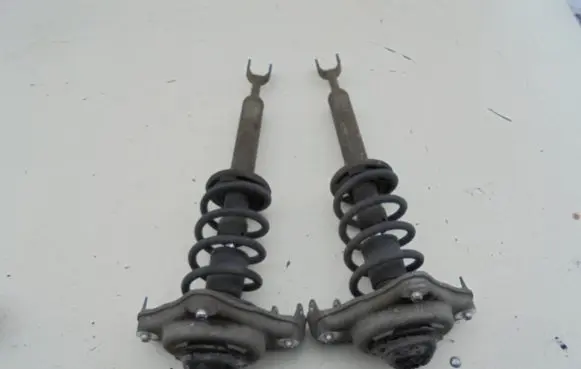 Renault Megane III Front shock absorber with coil spring MCPERSON