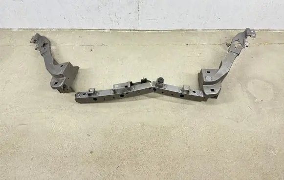 Radiator support slam panel