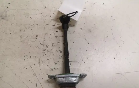 Front door check strap stopper