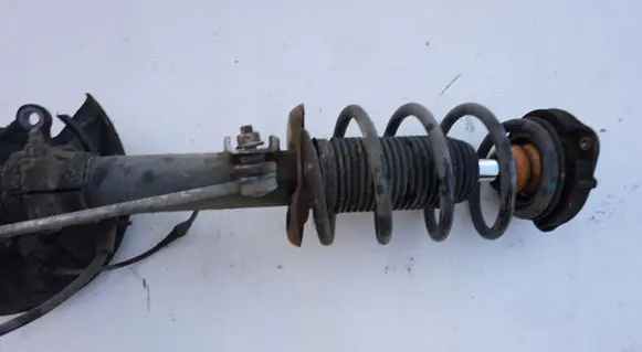 Volkswagen Scirocco Front shock absorber with coil spring MCPERSON