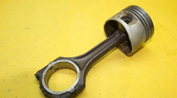 Piston with connecting rod