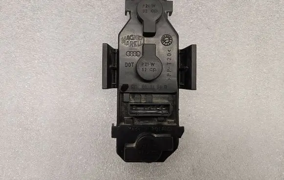 Tail light bulb cover holder