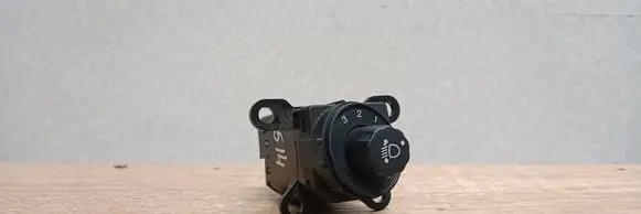 Headlight level height control switch