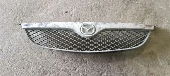 Mazda 626 Front bumper upper radiator grill