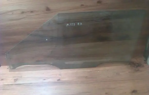 Mazda 323 Front door window glass four-door