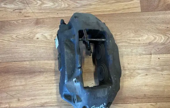 Volkswagen Touareg II Front brake caliper 7P6615105AF