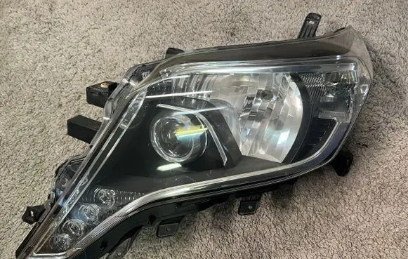 Toyota Land Cruiser (J150) Headlight/headlamp 8118560G70 8114560J20