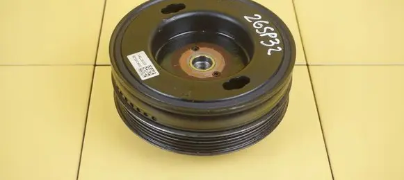 Opel Corsa E Timing belt tensioner pulley 55577791 B10XFT