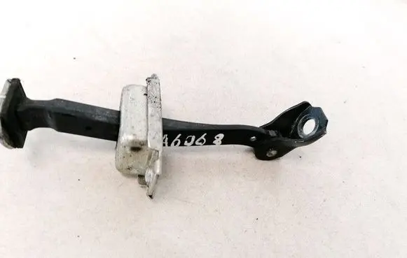 Front door check strap stopper