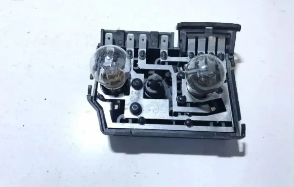 Tail light bulb cover holder