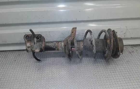 Subaru Impreza III Front shock absorber with coil spring