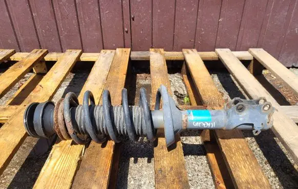 Volkswagen Caddy Front shock absorber with coil spring
