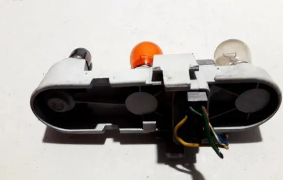 Tail light bulb cover holder