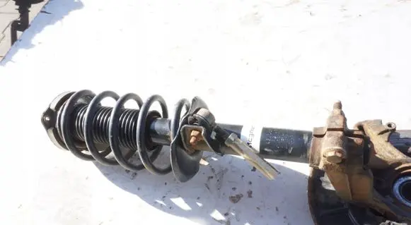 Volkswagen Caddy Front shock absorber with coil spring