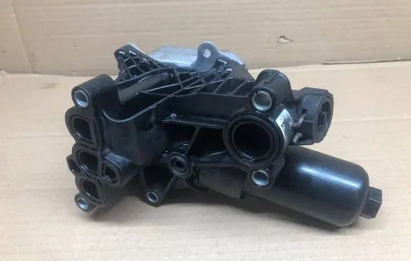 Skoda Octavia Mk4 Oil filter mounting bracket 05L115389AC