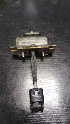 Front door check strap stopper