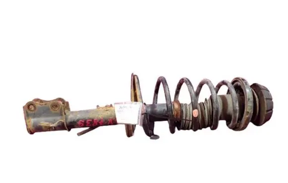 Suzuki Swift I Front shock absorber with coil spring