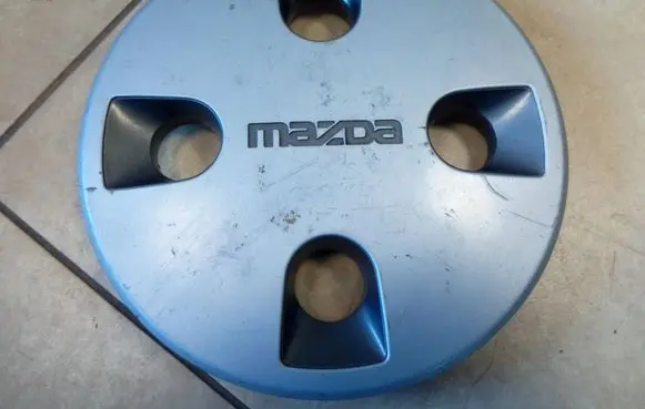 Mazda 323 Original wheel cap 6778 NE70220