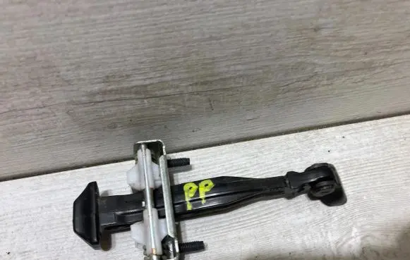 Ford Fiesta Front door check strap stopper H1BBA23500AA