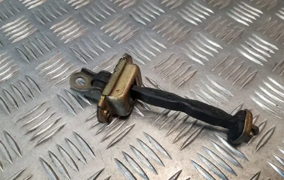 Front door check strap stopper
