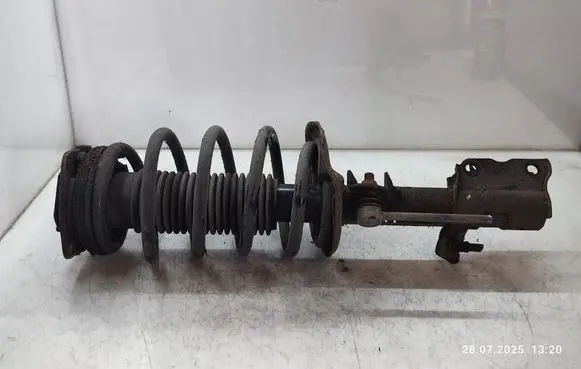 Nissan Qashqai+2 Front shock absorber with coil spring