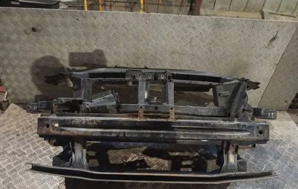 Radiator support slam panel