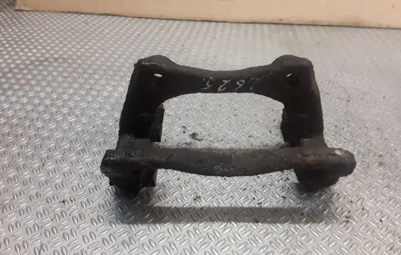Dacia Logan I Brake caliper pad carrier rear 