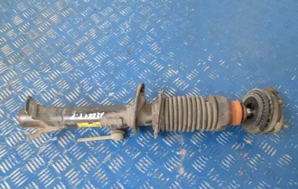 Mazda 323 F Front shock absorber with coil spring