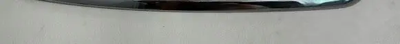Rear bumper trim bar molding