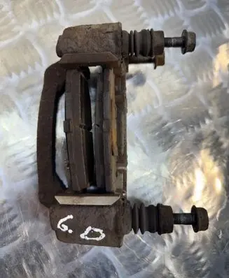 Subaru Legacy Brake caliper pad carrier rear 