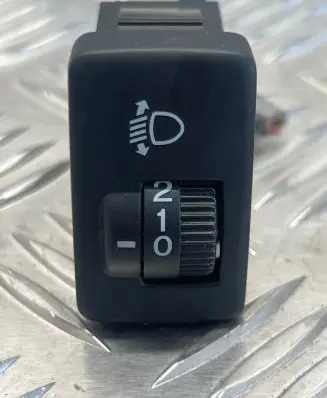 Headlight level height control switch
